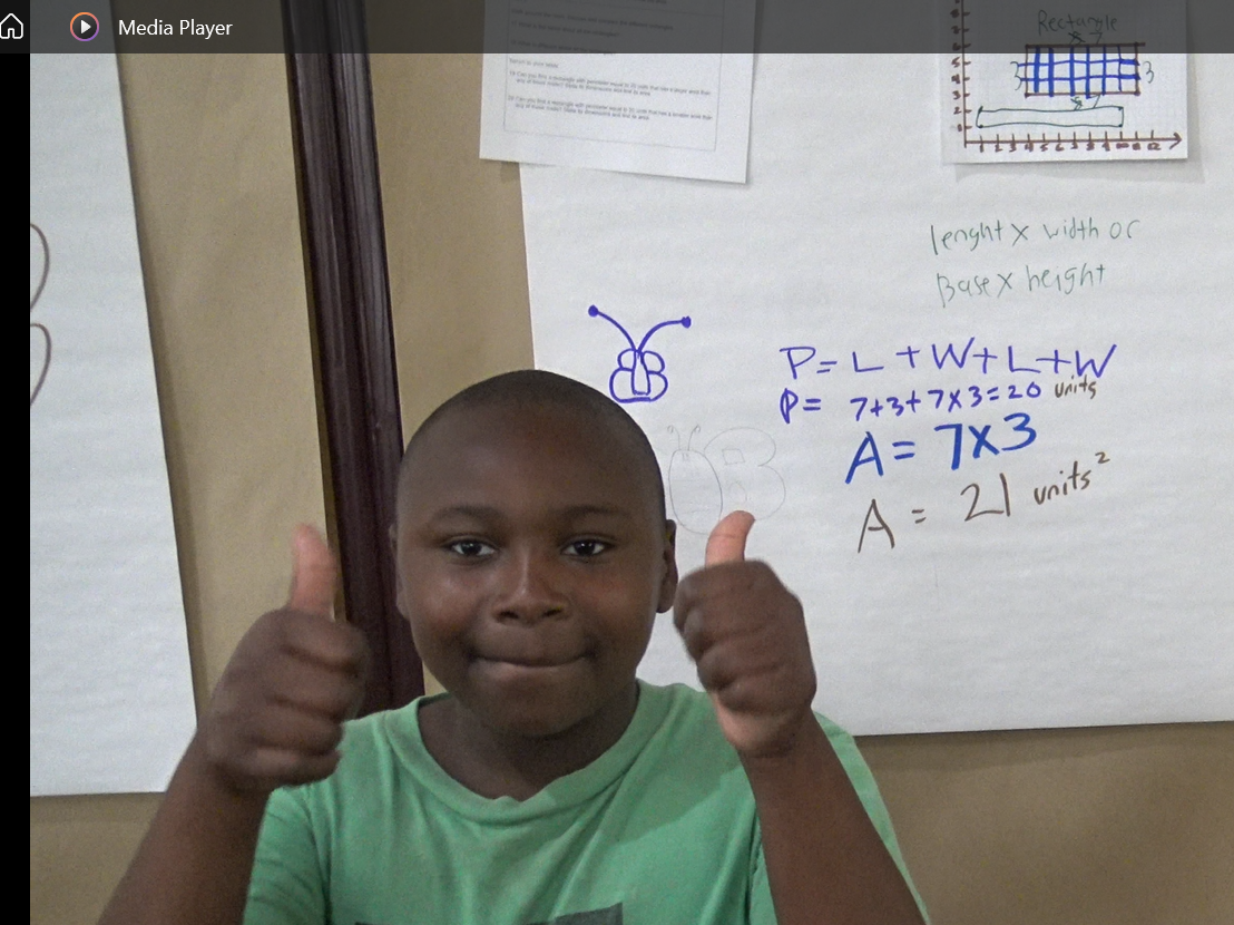 Student giving thumbs up
